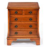 A miniature yew wood chest of drawers, late 20th c, 51cm h; 29 x 42cm Top slightly marked