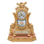 A French spelter gilt mantle clock, late 19th c, in Louis XVI style, inset with blue celeste