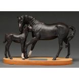 A Beswick connoisseur model of the horse "Black Beauty" and foal, wood base, 20cm h Good condition