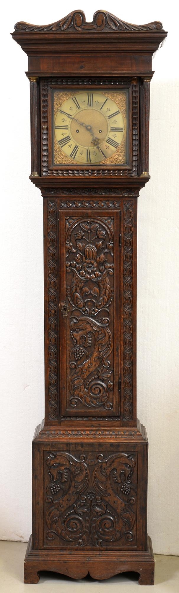 An oak eight day longcase clock, John Garfield fecit, 18th century, the brass dial with matted