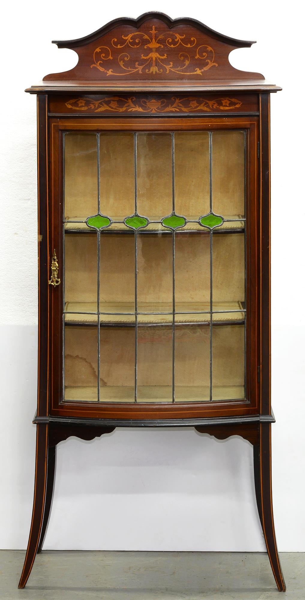 An Edwardian bow centred mahogany and line inlaid china cabinet, with leaded glass door, on