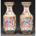 A pair of Chinese Canton famille rose vases, 19th c, typically decorated with panels of scenes,