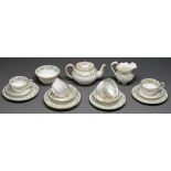 An Aynsley tea service, c1930, printed and painted with French style trailing sprigged borders,