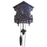 A Black Forest carved and stained walnut and parquetry  cuckoo clock, c1900, with pierced bone hands