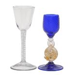 A George III wine glass, the rounded funnel bowl on double series opaque twist stem and conical