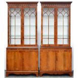 A pair of mahogany cabinets, 20th c, in George III style, the upper part with adjustable plate glass