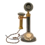 A black painted iron and brass candlestick type telephone Condition as seen