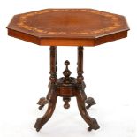 A Victorian walnut table, the octagonal top in matched veneers and inlaid with ivy leaf border, on