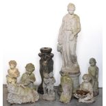 A reconstituted stone garden statuette of a young woman, on round pedestal, 131cm h and eight