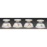 A set of four Furstenberg low candlesticks, 20th c, the domed foot decorated with fruit, 58mm h,