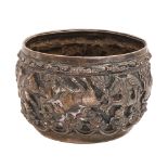 A Burmese silver repousse bowl, c1910, unusually worked upside down in high relief with a continuous