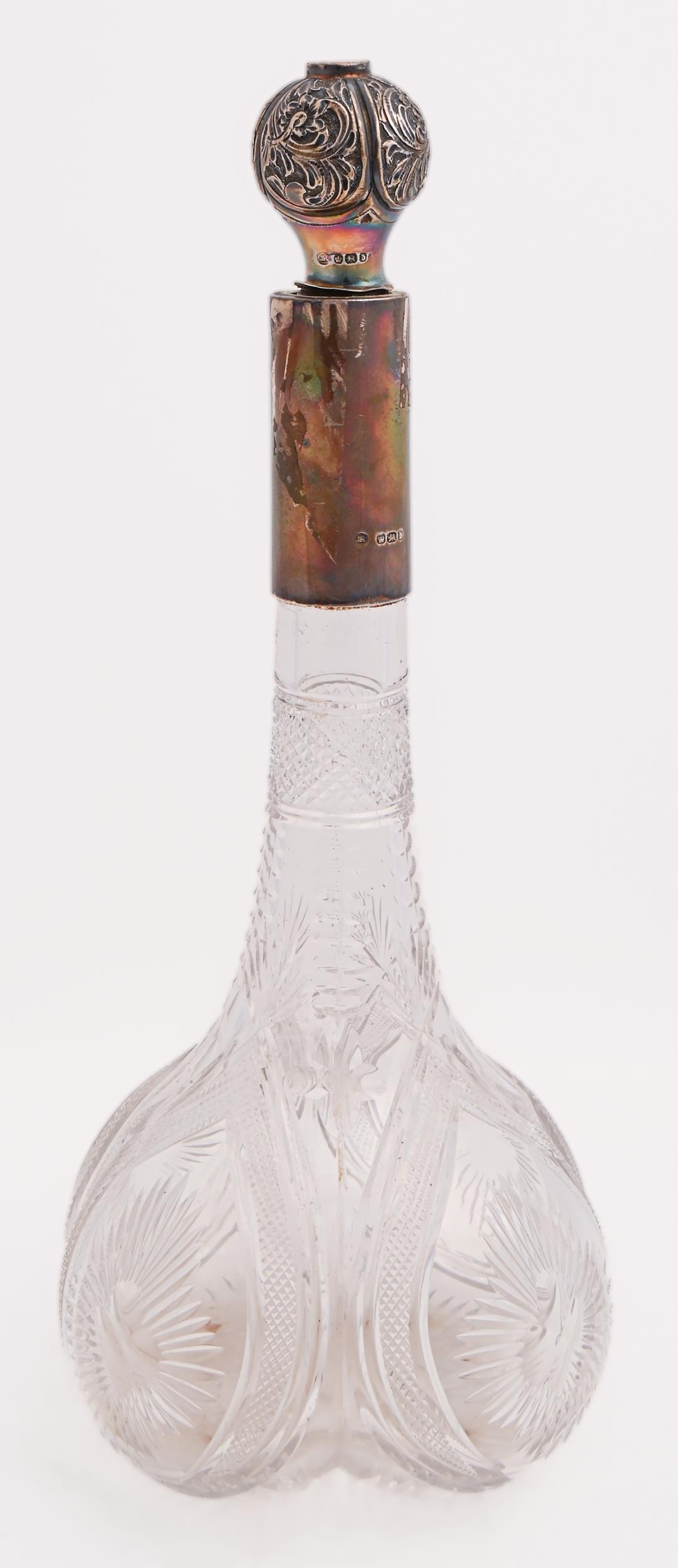 A Victorian silver mounted brilliant cut glass decanter and stopper, the lobed body with flared