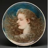A Copeland earthenware charger, outside decorated, 1878, painted by B Farrer with the head of a