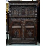 A joined oak livery cupboard, 19th century, incorporating earlier elements, of panelled construction