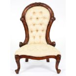 A Victorian carved walnut nursing chair In apparently good condition