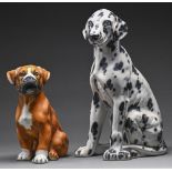A Continental painted earthenware model of a Dalmatian and a similar smaller model of a Boxer,