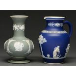 A Wedgwood green jasper dip vase and a dark blue jasper dip jug, both c1900, sprigged with classical