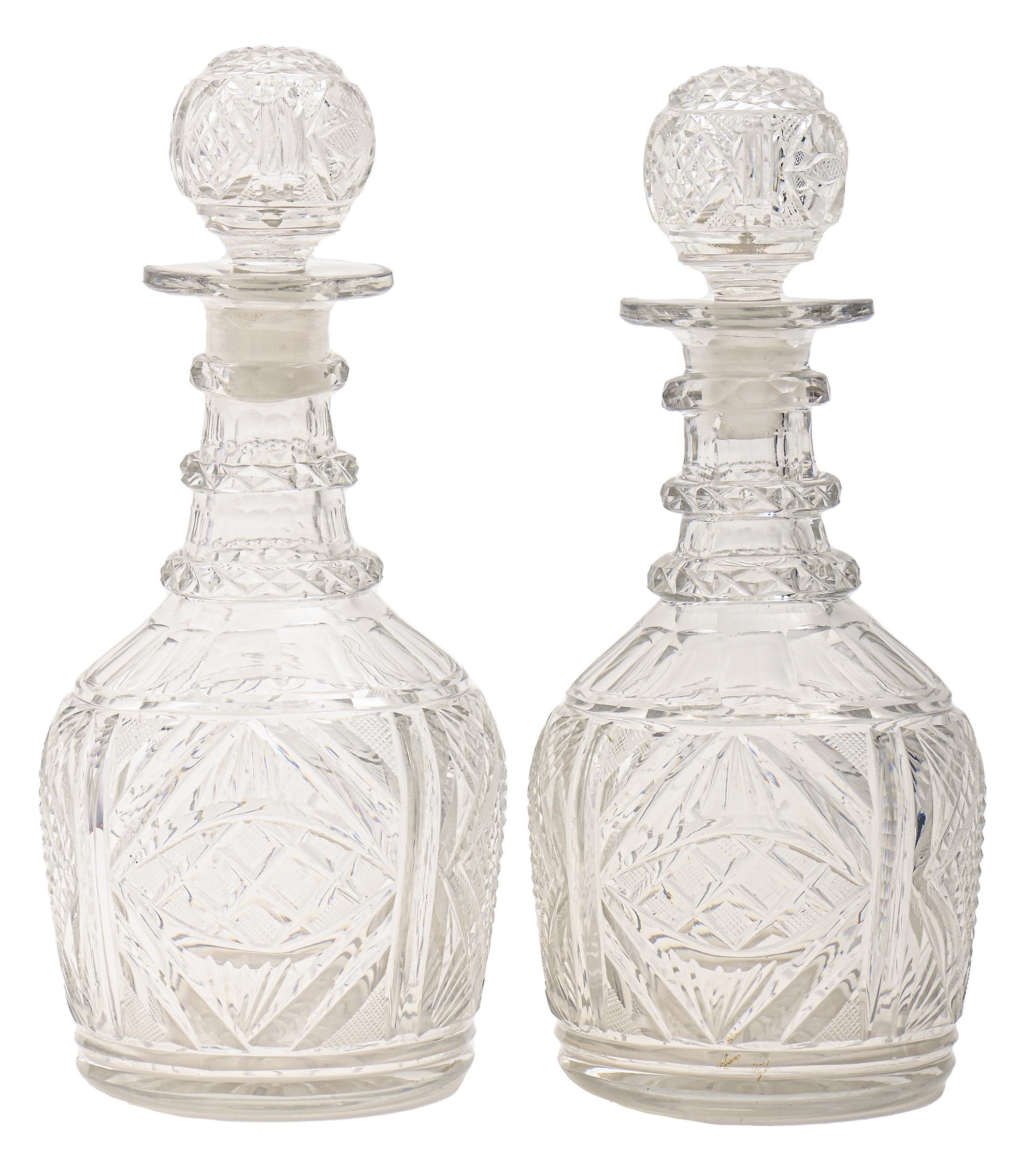 A pair of Anglo Irish glass Prussian decanters and stoppers, c1830, cut with diamonds, alternating