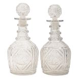 A pair of Anglo Irish glass Prussian decanters and stoppers, c1830, cut with diamonds, alternating