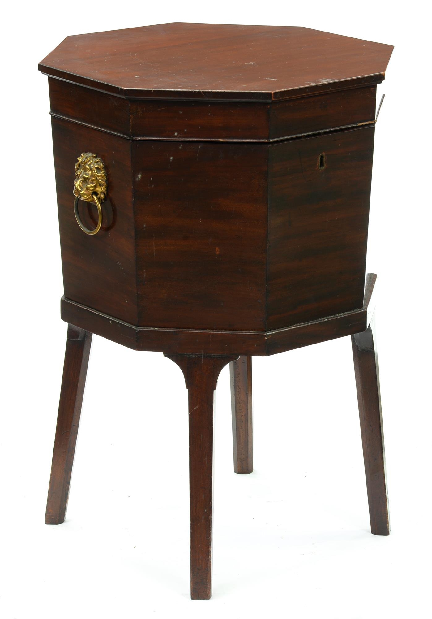 A George III mahogany octagonal wine cooler, with zinc liner, brass lion mask handles, on square