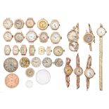 Twenty 9ct gold lady's wristwatches, first half 20th c, several with expanding metal bracelet,
