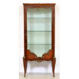 A French brass mounted mahogany cabinet, 20th c, in Transitional style, with marble slab, the door