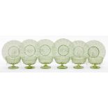 A set of six Venetian gold flecked green glass ribbed and footed coupes and stands, early 20th c,
