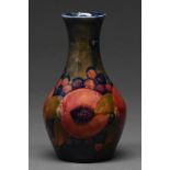 A Moorcroft Pomegranate vase, c1915-20, 14cm h, impressed mark, green painted initials Rim chipped