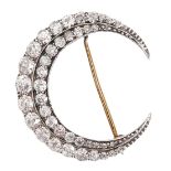 A Victorian diamond crescent brooch, of two rows of round and cushion shaped old cut diamonds,
