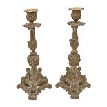A pair of Continental brass and bronzed metal altar candlesticks, 19th c, in 16th c Italian style,