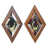 A pair of Edwardian diamond shaped painted bevelled glass mirrors, walnut frames, 59cm h Good