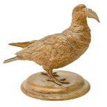 An Austrian or German gilt brass inkwell in the form of a bird with a letter in its beak, c1900,