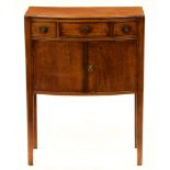 An Edwardian bow fronted mahogany pot cupboard, 78cm h; 30 x 57cm Top faded and slightly water