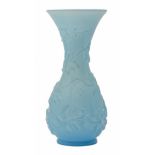 A South East Asian moulded blue glass baluster vase, 20th c, with spiralling flowers, 30cm h Good