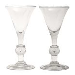 A pair of Victorian glass goblets, the trumpet bowl on solid stem with teared and bladed knops,