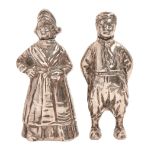 A pair of Dutch silver figural pepperettes, c1900, in the form of a boy and girl, 80mm h, maker's