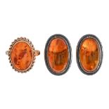 An amber ring, in 9ct gold, Birmingham 1992, 2.8g, size N and a pair of amber ear clips in silver (