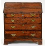 A George III oak bureau, 93cm l Damaged; old repairs and replacements
