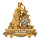 A French spelter gilt mantel clock, c1880, in the form of a classical maiden emblematic of,
