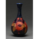 A Moorcroft Pomegranate vase, c1920, 21.5cm h, impressed marks, blue painted initials Good