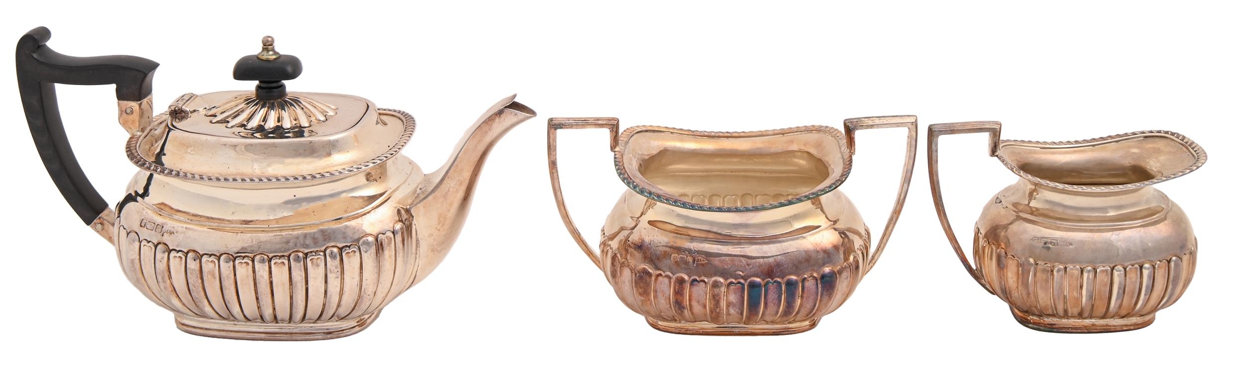 An Edwardian silver bachelors tea service, teapot 11.5cm h, by Walker & Hall, Sheffield 1903 and 04,