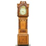 A Victorian eight day oak mahogany, rosewood and inlaid longcase clock, the breakarched painted dial