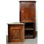 Two George III oak corner cabinets, one on associated base Condition evident from image