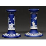 Two Wedgwood dark blue jasper dip candlesticks, late 19th c, sprigged with mythological subjects,