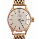 An Omega 9ct gold lady's wristwatch, 19mm diam, Birmingham 1963, on 9ct gold bracelet and