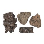 A Medieval red stone architectural corbel, 13th/14th c, carved with foliage, 22cm wide, another,