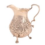 A George III silver cream jug, on three hoof feet, later chased, 10cm h, maker AF, probably Andrew