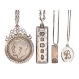 A silver pendant set with a half crown 1915, a silver bar pendant and several silver chains, 2ozs