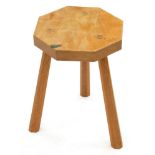 An Adam Jackson oak tripod stool, 20th c, in the manner of the Yorkshire critters, octagonal seat