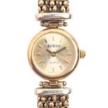 A Ca' Doro 9ct gold lady's wristwatch, quartz movement, 19mm diam, on gold three strand bracelet,